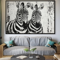 תמונת קנבס אמנותית בשחור-לבן של זוג זברות עם הדפסה חלקה ואיכותית – מתוך קולקציית NEXTGEN BY BAR של תכשיט לבית.