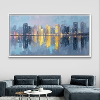 תמונת קנבס של קו רקיע עירוני בגווני כחול וזהב עם השתקפות במים