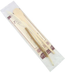 An elegant set for eliminating chametz contains a wooden spoon feather and a wax candle