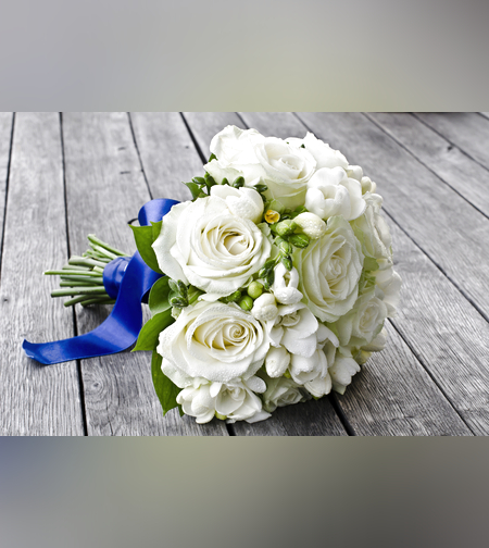 Bridal bouquet with white roses and freesia
