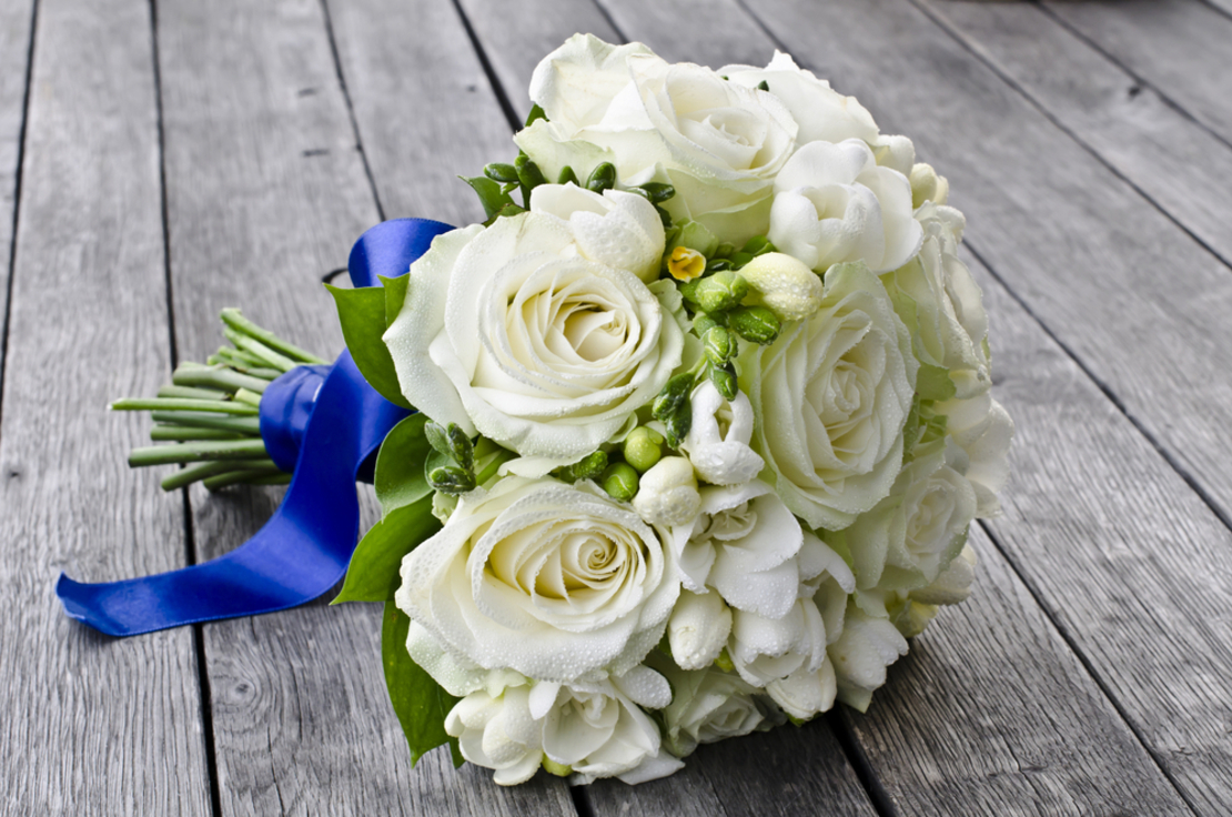 Bridal bouquet with white roses and freesia