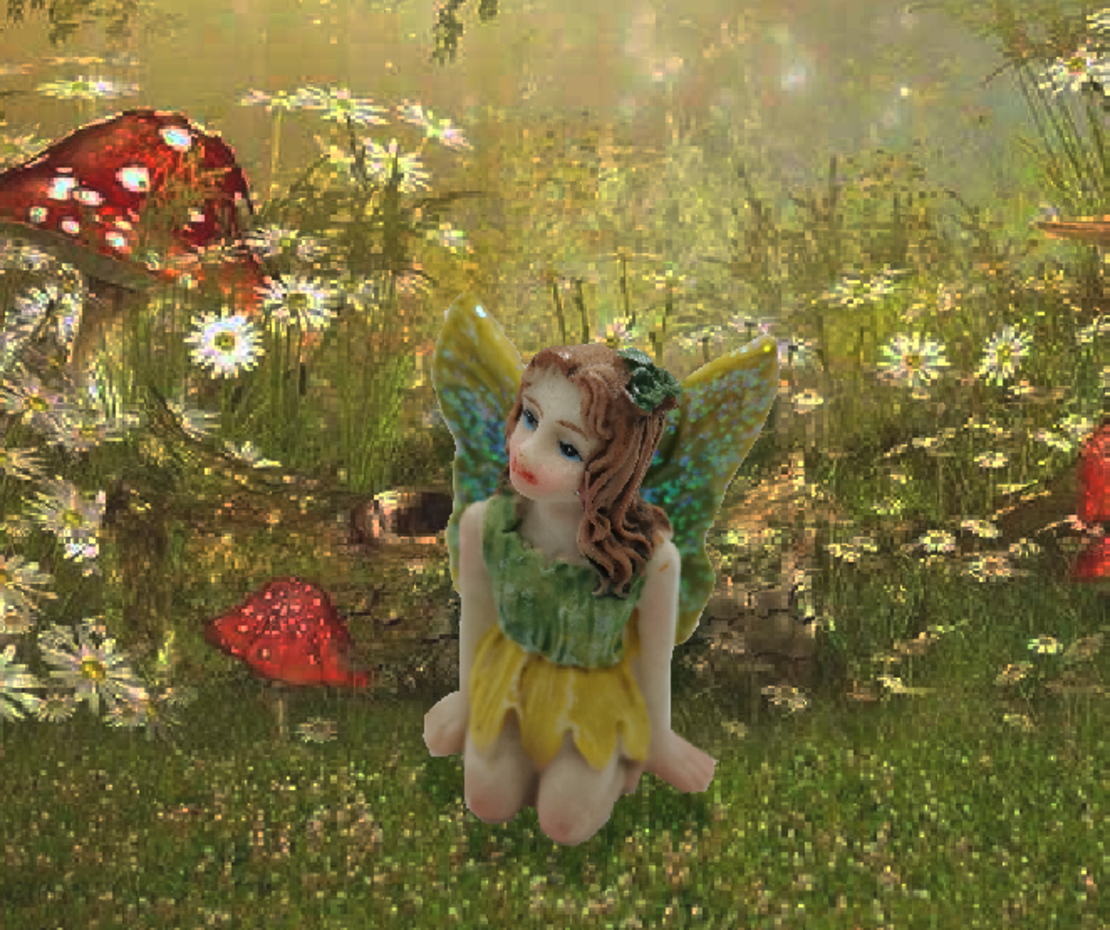 פיה יושבת עם נצנצים הכנפים