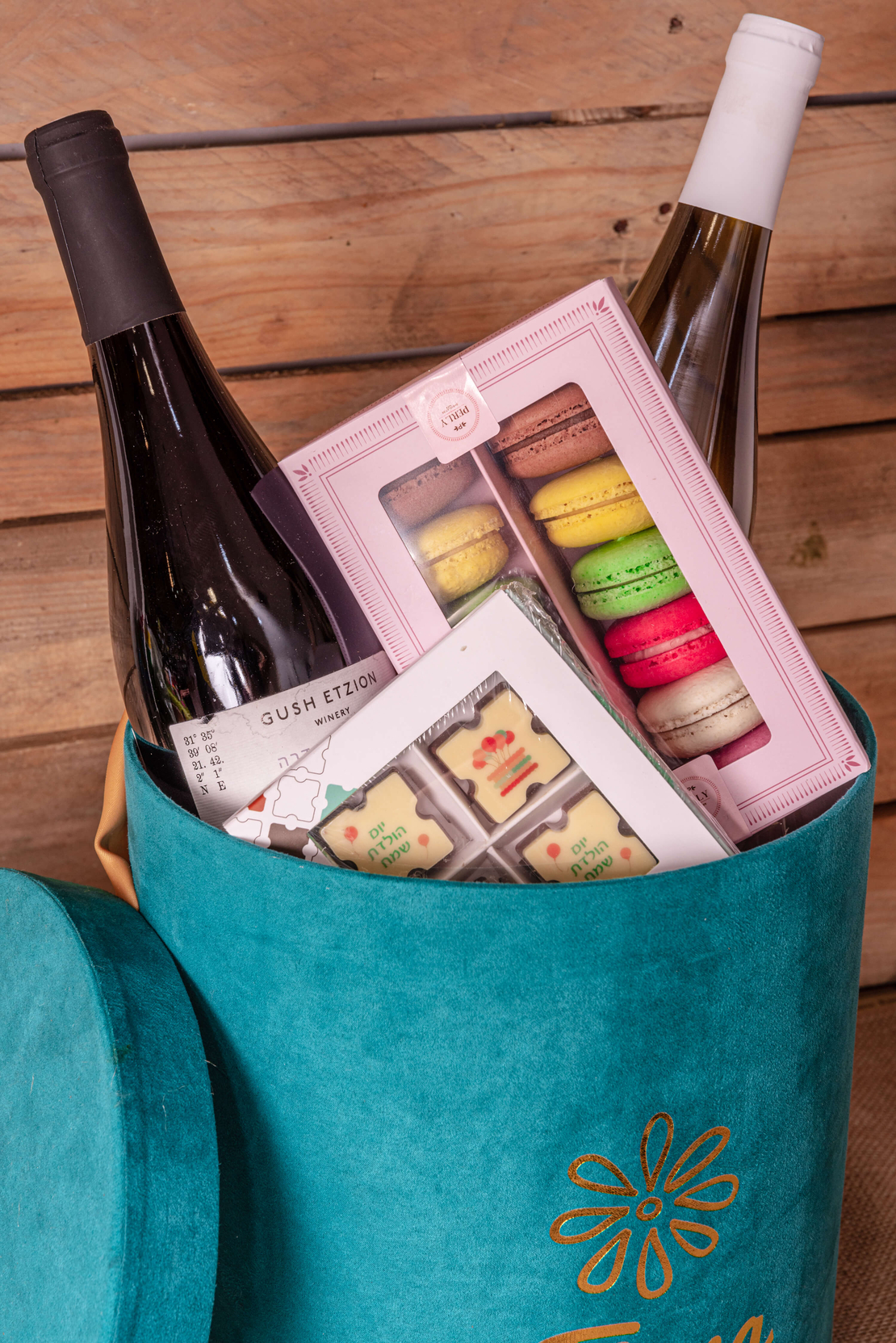 French chocolate box with two bottles of wine and macaroons 