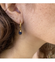 Thin hoop earring with a blue drop