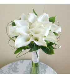 A bridal bouquet with callas
