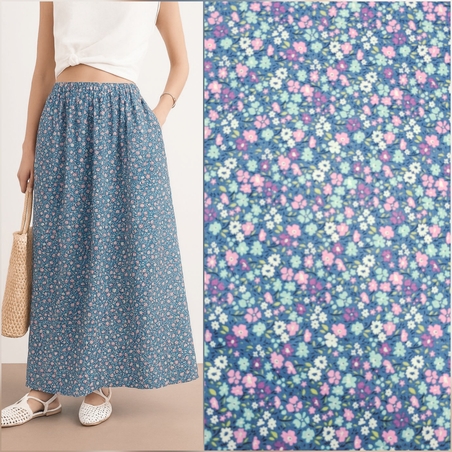 אריג כותנה דפוס פרחים שמחים על רקע כחול גינס דגם דניאל