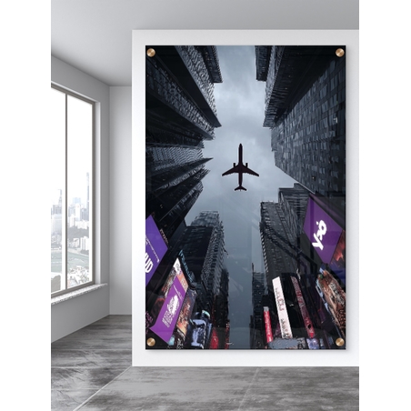 תמונת זכוכית של מטוס חולף מעל גורדי שחקים במראה אורבני דרמטי – NEXTGEN BY BAR