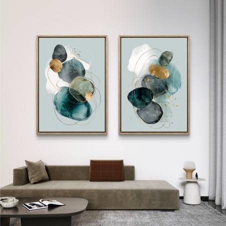 זוג תמונות קנבס בעיצוב מופשט בגווני תכלת וזהב, עם קווים עדינים ועיצוב יוקרתי מבית תכשיט לבית