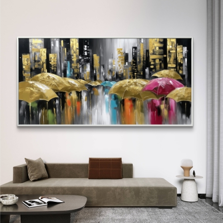 תמונת קנבס לרוחב עם מטריות בצבעי זהב, ורוד וטורקיז מול רקע בניינים מוזהבים ואפורים – עיצוב יוקרתי מבית תכשיט לבית.