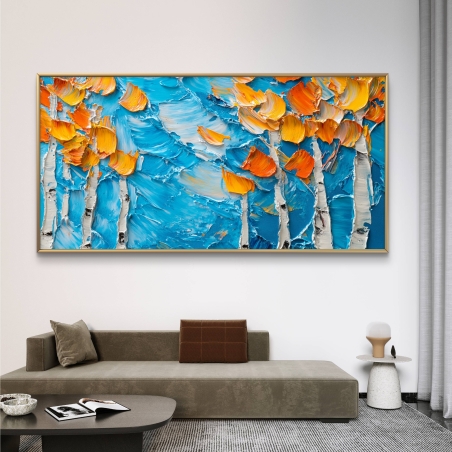 תמונת קנבס רחבה המציגה עצי שלכת בגווני כתום על רקע כחול עוצמתי, עם טקסטורה ייחודית ותנועת צבע טבעית, המוסיפה עומק ותחכום לחלל.