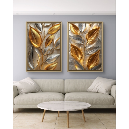 זוג תמונות קנבס עם עלים תלת־ממדיים בגווני זהב וכסף על רקע מטאלי יוקרתי