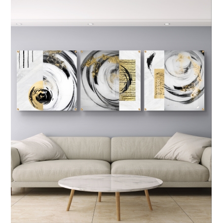 שלוש תמונות זכוכית מרובעות עם תנועות מעגליות בשחור וזהב, מודפסות על זכוכית חלקה באיכות גבוהה.