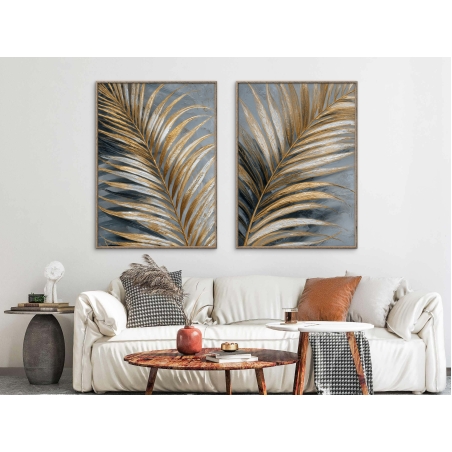 זוג תמונות קנבס בעיצוב עלים יוקרתיים בגווני זהב ואפור עם הדפסה חלקה – מתוך קולקציית תכשיט לבית.