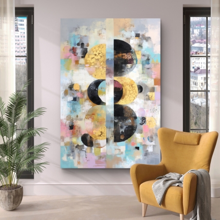 תמונת קנבס עם עיגולים שחורים וזהובים על רקע צבעוני מופשט בגווני פסטל, מודפסת באיכות גבוהה עם גימור חלק.