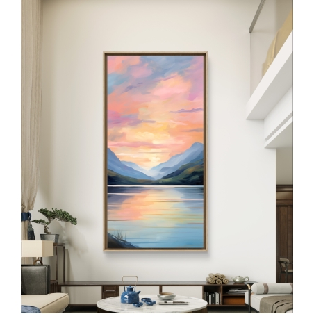 תמונת קנבס לאורך של זריחה צבעונית המשקפת באגם מוקף הרים, בגוונים חמימים של ורוד, כתום וכחול עדין, בסגנון אומנותי מודרני.