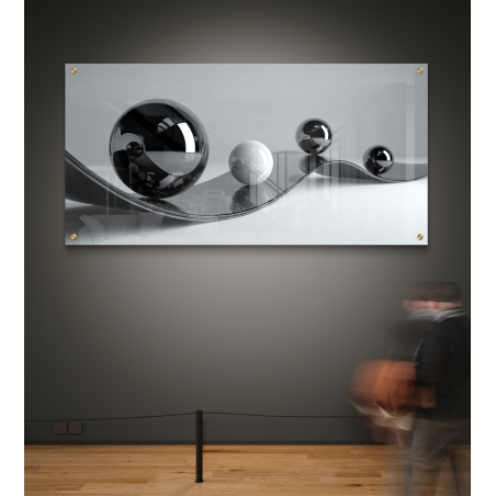 תמונת זכוכית לרוחב עם כדורים תלת־ממדיים בגווני שחור, לבן ואפור על רקע מינימליסטי