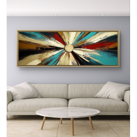 תמונת קנבס פנורמית עם קרני צבע בגוונים טורקיז, אדום, שחור וזהב, יוצאות ממרכז בהיר – תלויה מעל ספה מודרנית בעיצוב מרשים.