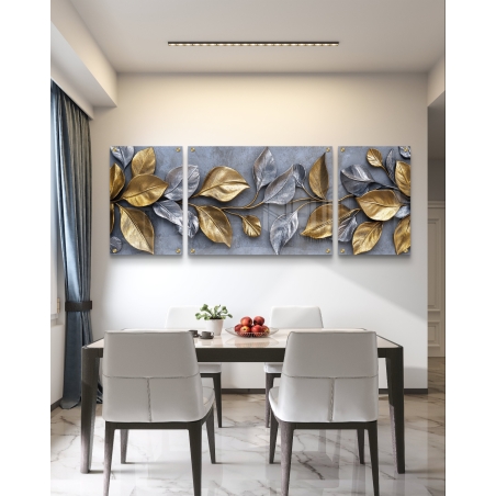 תמונת זכוכית מחולקת לשלושה חלקים עם עלים מעוצבים בגווני זהב וכסף על רקע אפור בטון – עיצוב יוקרתי מהקולקציה של תכשיט לבית.