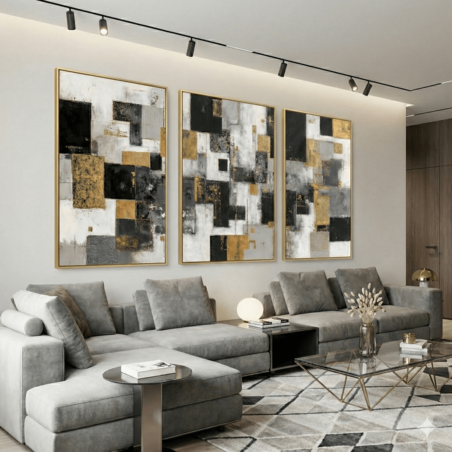 שלישיית תמונות קנבס אבסטרקטיות בגווני אפור שחור וזהב בעיצוב מודרני לסלון יוקרתי