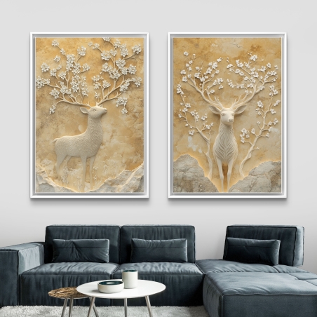זוג תמונות קנבס המציגות אייל אצילי עם ענפי פריחה עדינים בגווני שמנת וזהב, מתאימות לחללים המעוצבים בסגנון קלאסי ויוקרתי.