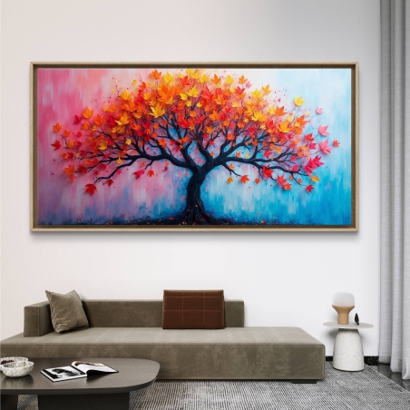 תמונת קנבס צבעונית לרוחב עם ציור של עץ עלים אדומים-כתומים על רקע ורוד-תכלת, תלויה מעל ספה מודרנית.