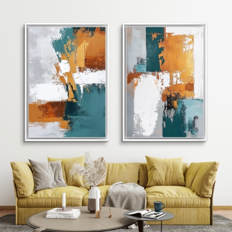 זוג תמונות קנבס בגווני כתום, טורקיז ולבן בעיצוב אבסטרקטי תלויות זו לצד זו בחלל מודרני עם מדפים מעוצבים.