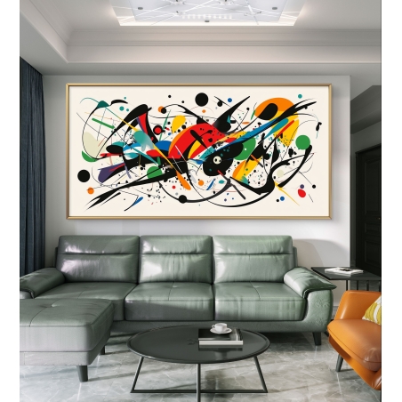תמונת קנבס צבעונית ומופשטת עם קווים ונקודות בגווני שחור, אדום, ירוק, כחול וצהוב, תלויה מעל ספה ירוקה בסלון מודרני מעוצב.