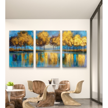 שלוש תמונות זכוכית עם עצים זהובים מעל מים כחולים, עם השתקפות צבעונית עזה, עיצוב מודרני יוקרתי מקולקציית תכשיט לבית