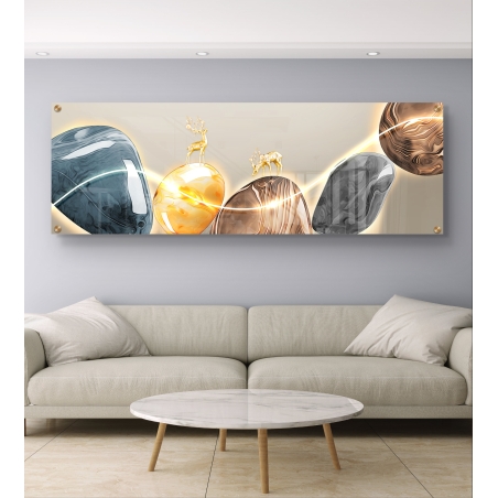 תמונת זכוכית פנורמית עם איילים מוזהבים על אבנים בגווני אפור, זהב וחום עם קו אור זוהר, מודפסת בהדפסה חלקה ואיכותית.