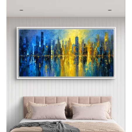 תמונה קנבס לרוחב של קו רקיע עירוני בצבעי כחול וזהב עם השתקפות במים, מתוך קולקציית תכשיט לבית