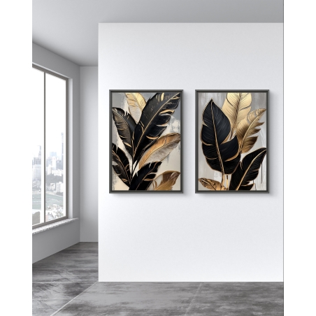 זוג תמונות קנבס עם איורים של עלים טרופיים בגווני שחור וזהב על רקע בהיר – עיצוב אלגנטי מקולקציית תכשיט לבית.