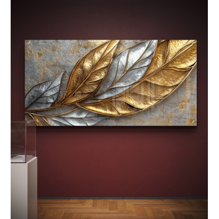 תמונת זכוכית לרוחב עם עלים תלת־ממדיים בגווני זהב וכסף על רקע אפור מחוספס – עיצוב יוקרתי ומודרני לקישוט קירות הבית.