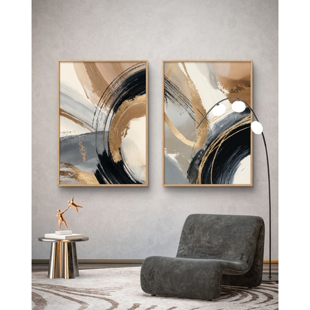 זוג תמונות קנבס מופשטות בגווני שחור, זהב וחום בהיר עם משיחות צבע רחבות בעיצוב מודרני