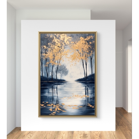תמונת קנבס של יער סתיו בצבעים כחולים וזהובים, משתקף באגם, תלויה בין שני חלונות בחדר מודרני עם כורסה צהובה