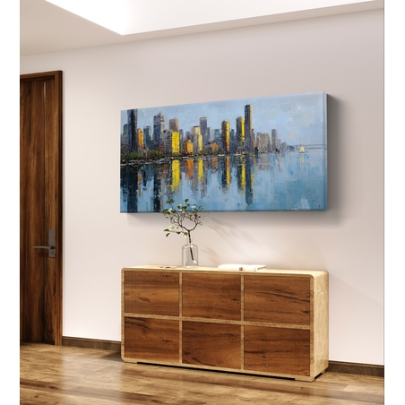 תמונת קנבס לרוחב של קו רקיע עירוני עם השתקפות במים בגווני כחול וזהב, לעיצוב סלון מודרני ואלגנטי