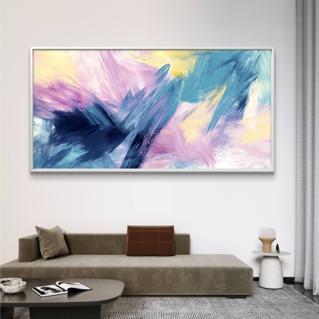 תמונת קנבס מופשטת בגווני ורוד, כחול וצהוב על רקע בהיר במסגרת זהובה – עיצוב מודרני מקולקציית תכשיט לבית.