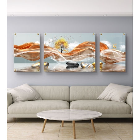 שלישיית תמונות זכוכית עם גלים בצבעי נחושת, עץ זהוב, צבאים ונגיעות של אבן טבעית על רקע מים שקופים