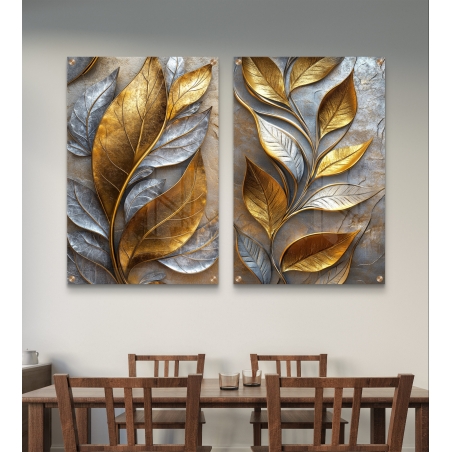 זוג תמונות זכוכית עם עלים תלת-ממדיים בגווני זהב וכסף, לעיצוב קיר מודרני ואלגנטי בחללי מגורים או פינת אוכל.