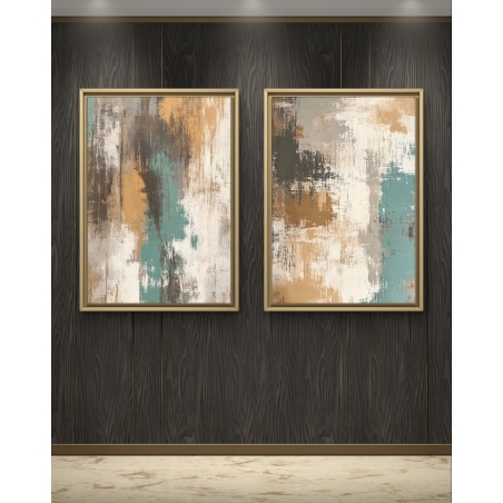 תמונות קנבס מופשטות בגווני כחול, חום ולבן עם מסגרת זהב, תלויות על קיר עץ כהה ומוארות בתאורה ייחודית.