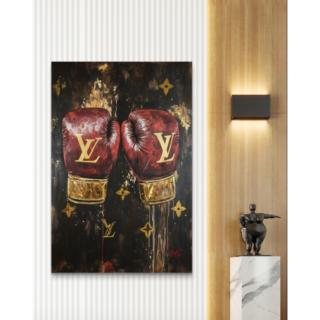 תמונת קנבס המציגה זוג כפפות אגרוף אדומות עם עיטורי זהב על רקע כהה - שילוב יוקרתי של עוצמה ואומנות בעיצוב מודרני.