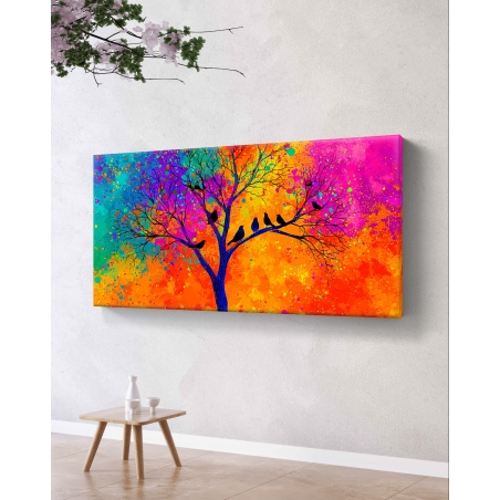 תמונת קנבס לרוחב עם עץ כהה וציפורים בצללית שחורה על רקע צבעוני מתפרץ בסגנון מודרני, בהדפסה חלקה מבית תכשיט לבית.