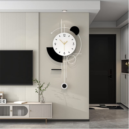 שעון קיר גיאומטרי מודרני בצבעי שחור ולבן, עם מסגרת אלגנטית, מחוגים עדינים ומטוטלת עיצובית, תוספת מושלמת לכל קיר בבית.