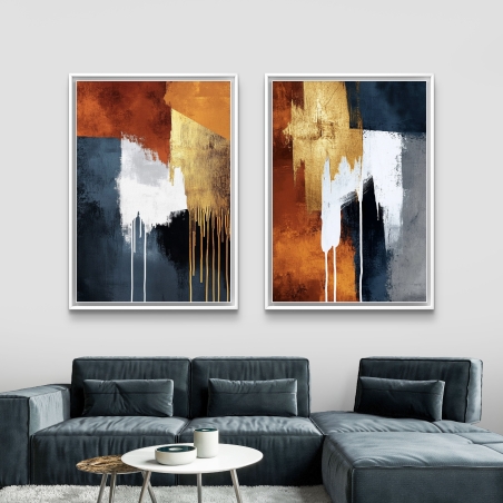 זוג תמונות קנבס בגוונים כתום, זהב, כחול ולבן בעיצוב אבסטרקטי עם טפטופי צבע ודגש על ניגודיות חזקה, מתוך הקולקציה של תכשיט לבית.