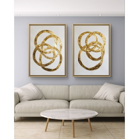 זוג תמונות קנבס עם עיצוב עיגולים בזהב על רקע לבן, בסגנון מופשט ומודרני