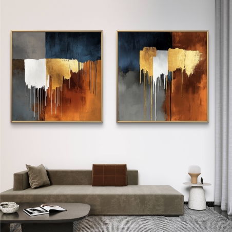זוג תמונות קנבס מרובעות בעיצוב מופשט עם טפטופי צבע דרמטיים, בגוונים של כחול כהה, כתום ונגיעות זהב, מושלם להשלמת חלל בעיצוב מודרני ואלגנטי.