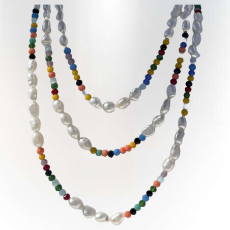 A long string of wild white pearls combined with colorful Swarovski stones
