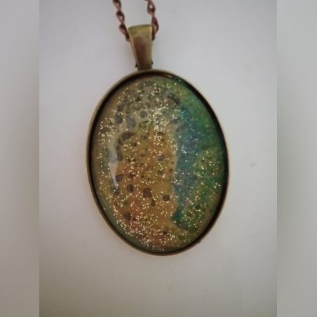 עדליון מתכת וזכוכית אובלי  ירוק וחום עם נצנוצי זהב