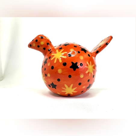 פסלון של ציפור כתומה מעוטרת