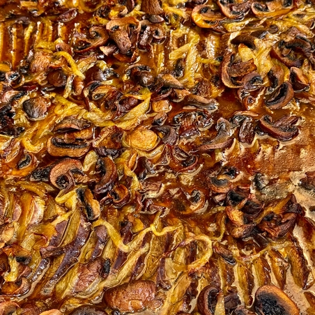 Roast shoulder in a rich mushroom sauce