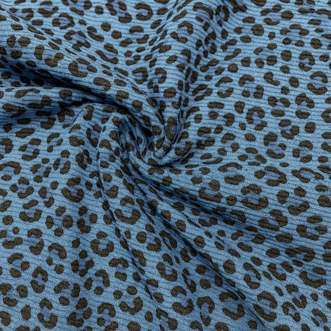 אריג קורדרוי בייבי מנומר על רקע כחול גינס